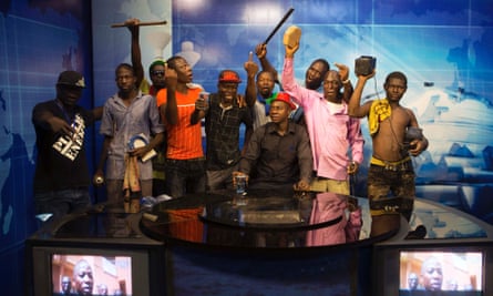 Anti-government protesters take over the state TV podium in Ouagadougou