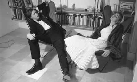 The designer and restaurateur Terence Conran, founder of Habitat, and his wife, Shirley, the journalist and author, relaxing at home in hammock chairs (1955).