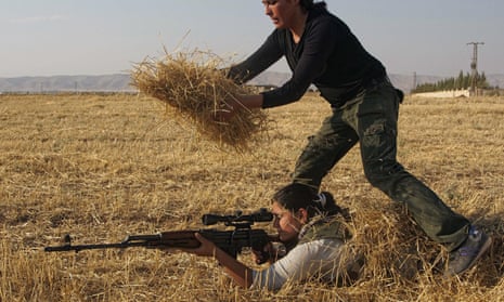 A Young Syrian-Kurdish woman hides a par