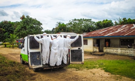 Health workers transport the body of a person suspected to have died of Ebola in Port Loko, on the outskirts of Freetown.