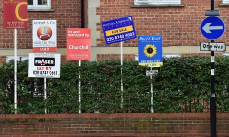 Property sale and rental signs in London.