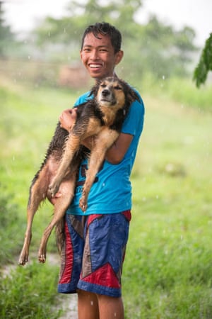 John Manuel, 15, with his dog, Bruno