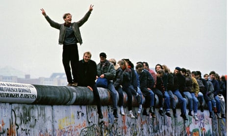 West Germans Celebrate The Unification Of Berlin Atop The Berlin Wall During The Collaps