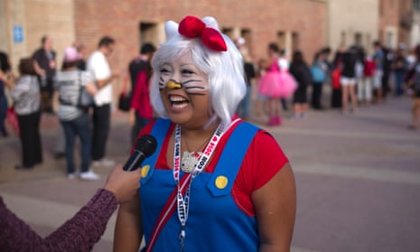 Carolyn Molina, of Riverside, California, laughs while talking to a reporter at the Hello Kitty Con, the first-ever Hello Kitty fan convention in Los Angeles.