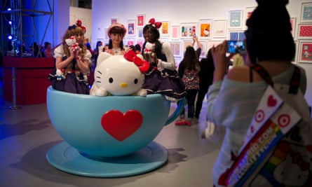 Hello Kitty fans pose for photos in a giant tea cup at the Hello Kitty Con.