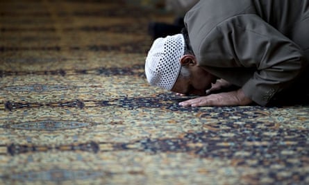 A muslim man prays during a prayer sessi
