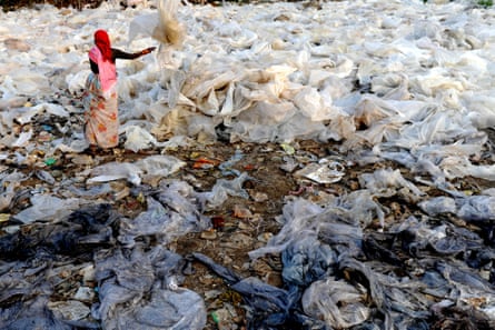 An Indian worker sorts plastics obtained from garbage at a dump on the outskirts of Mumbai.
