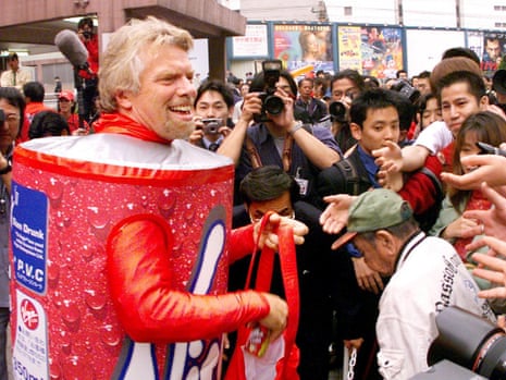 Sir Richard Branson hands out free cans of Virgin Cola in downtown Tokyo. Sales of the brand lost fizz against the might of Coca-Cola and Pepsi.