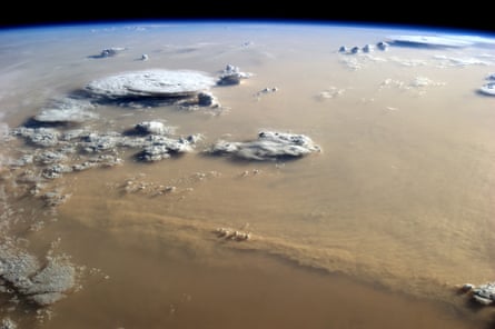 Dust and Clouds Dance Over the Sahara