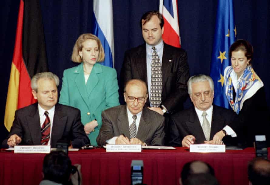 President Slobodan Milosevic of Serbia (L), President Alija Izetbegovic of Bosnia-Herzegovina (C) and President Franjo Tudjman of Croatia sign the Dayton Agreement peace accord at the Hope Hotel inside Wright-Patterson Air Force Base in this November 21, 1995.