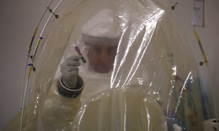 A microbiologist prepares to test blood samples for Ebola at a US navy mobile laboratory in central Liberia, part of the American response to the epidemic.
