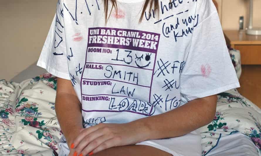A woman wearing a signed freshers' week T-shirt