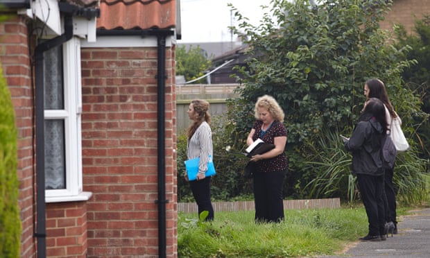Council officers on a house inspection in Wisbech. Photograph: Andy Hall for the Guardian