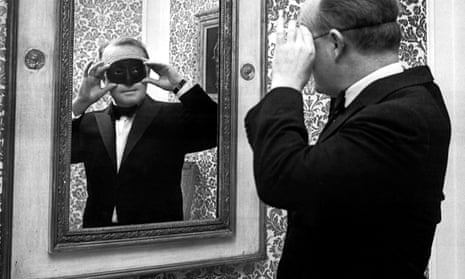 Truman Capote wears a mask for a costume ball at the Plaza hotel, New York, in 1966