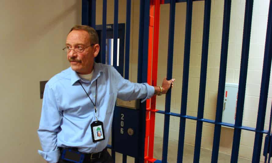 Two Rivers Regional Detention Facility Warden Ken Keller waits for a locked gate to be opened.