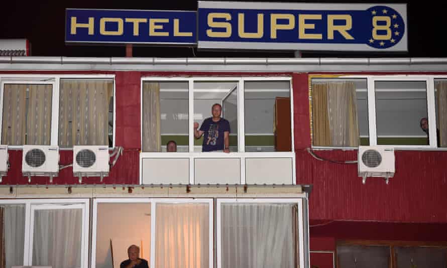 Guests quarantined in the Hotel 'SUPER 8' look out from their windows, being not allowed to leave the hotel in Skopje, The Former Yugoslav Republic of Macedonia, 09 October 2014.