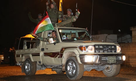 Kurdish peshmerga forces arrive in Suruc, near Turkey's border with Syria, en route to Kobani