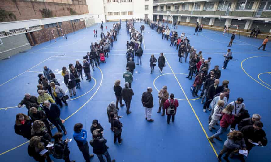Voters queue to take part in the symbolic Catalan independence referendum.