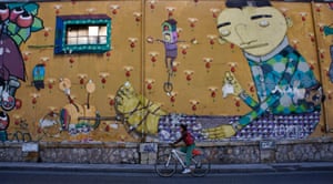 Walls are adorned with works of contemporary graffiti on the streets of Athens