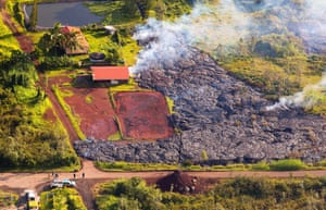 The stream of lava sets a home alight in Pahoa on 10 November