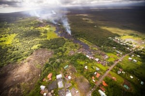 Lava creeps out at several spots about 145 metres from Pahoa Village Road