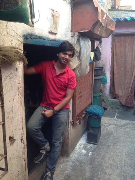 Inder Vhatwar standing in the doorway of his old house in the Golibar slum