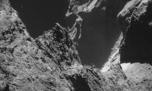 Cliffs rise from the shadows in this dramatic close-up of the comet.