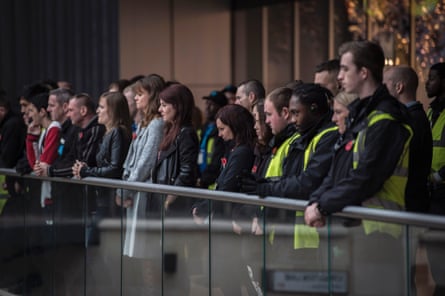 Staff from Cabot Circus shopping centre in Bristol pay their respects during the two minute silence.