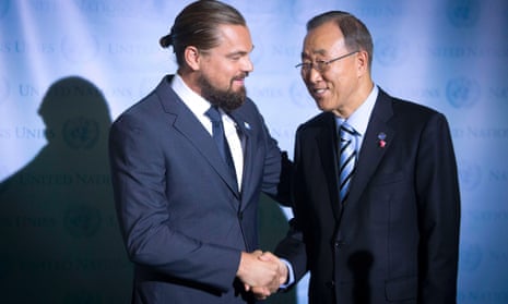Actor Leonardo DiCaprio (L) and United Nations Secretary General Ban Ki-moon shake hands