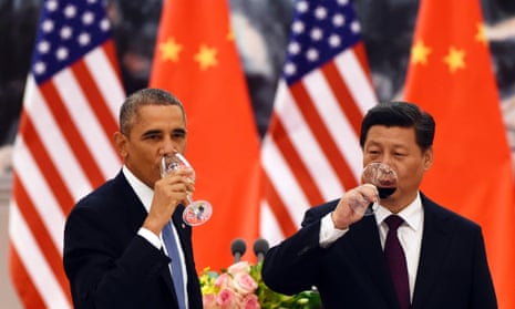 Barack Obama and Chinese President Xi Jinping have a drink after a toast at a lunch banquet in the Great Hall of the People in Beijing.