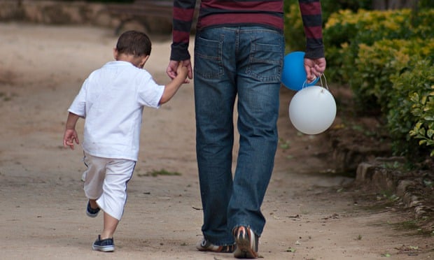 little boy holding fathers hand. Image shot 2011. Exact date unknown.