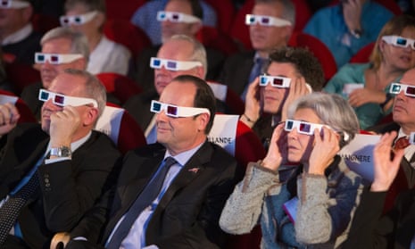 French National Centre for Space Studies president Jean-Yves Le Gall, left, French president Francois Hollande, centre, and former French minister and astronaut Claudie Haignere, right, wear 3D glasses during a broadcast of the Rosetta mission at the Cite des Sciences, Paris.
