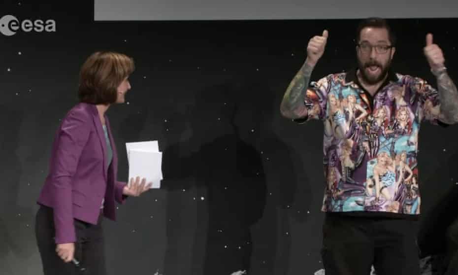 Screengrab of Dr Matt Taylor introduced on stage Monika Jones during a video livestream of European Space Agency's Rosetta mission.