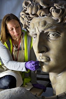 Johanna Puisto, sculpture conservator at the Victoria and Albert Museum, works on the David statue