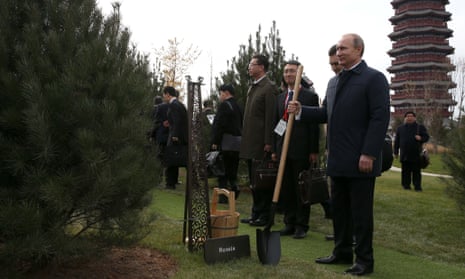 Russian President Vladimir Putin planting trees.