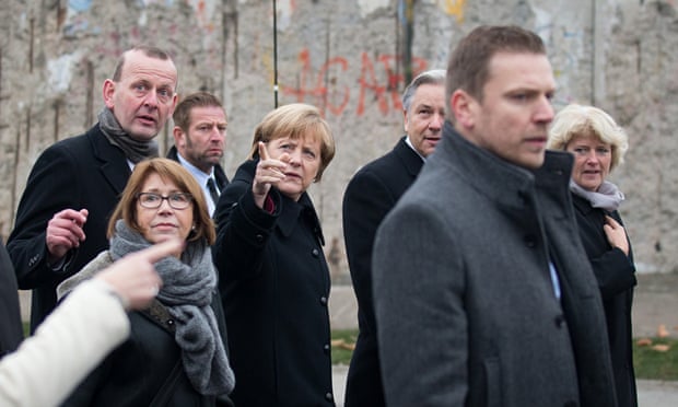 Germany's chancellor, Angela Merkel, at the Berlin Wall.