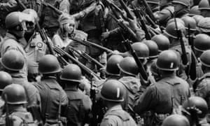 1969: National guardsmen, called out by Governor Reagan to quell demonstrations, surround a Vietnam war protester during the People’s Park riot. The guardsmen herded protesters into a carpark with bayonets