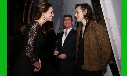 The Duchess of Cambridge meets Harry Styles of One Direction as Simon Cowell looks on at the end of the Royal Variety Performance at the London Palladium.