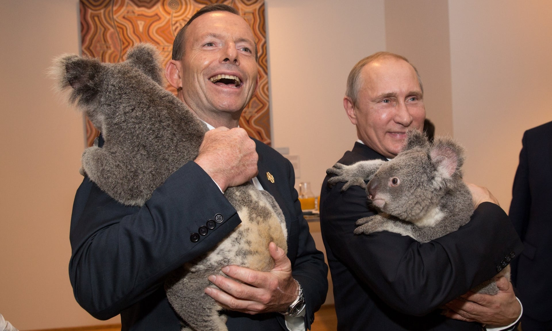 Tony Abbott and V. Putin hold a koala at G20 Australia, 2014.