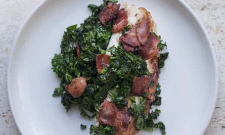 sea bass, bacon and kale on a plate