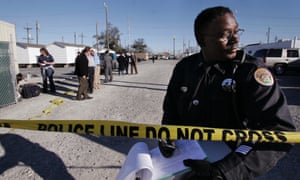 A New Orleans police officer stands at a crime scene. The city's police department will reopen hundreds of rape and child abuse cases after it came to light that they were initially mishandled.