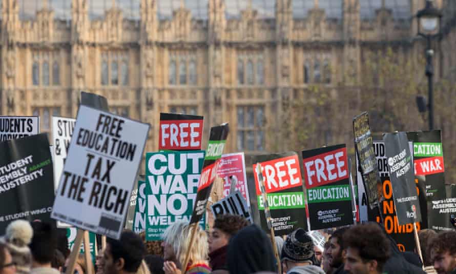 Demonstrators pass the Houses of Parliament during a protest in favour of free education.