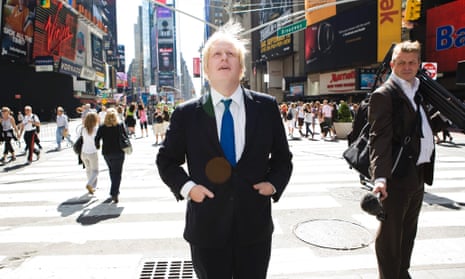 Boris Johnson walks around Times Square in New York City.