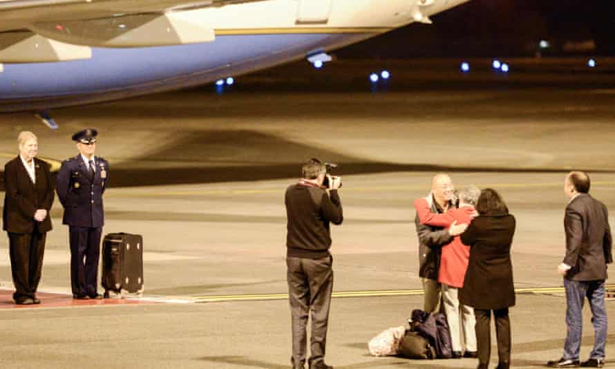 A handout picture made available by the US Air Force on 10 November 2014 shows Kenneth Bae (4-R), hugging his mother for the first time in more than two years after returning to the United States on 8 November 2014.