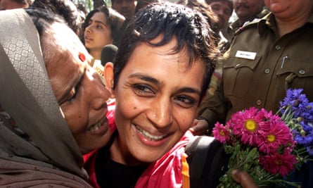 Roy is kissed by supporters in 2002 after being released from Tihar Jail in New Delhi. She had been jailed during a campaign against a new dam.