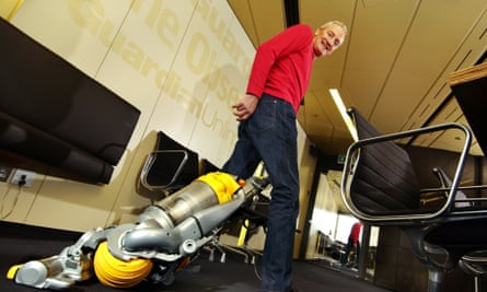 Inventor James Dyson with one of his vacuum cleaners.