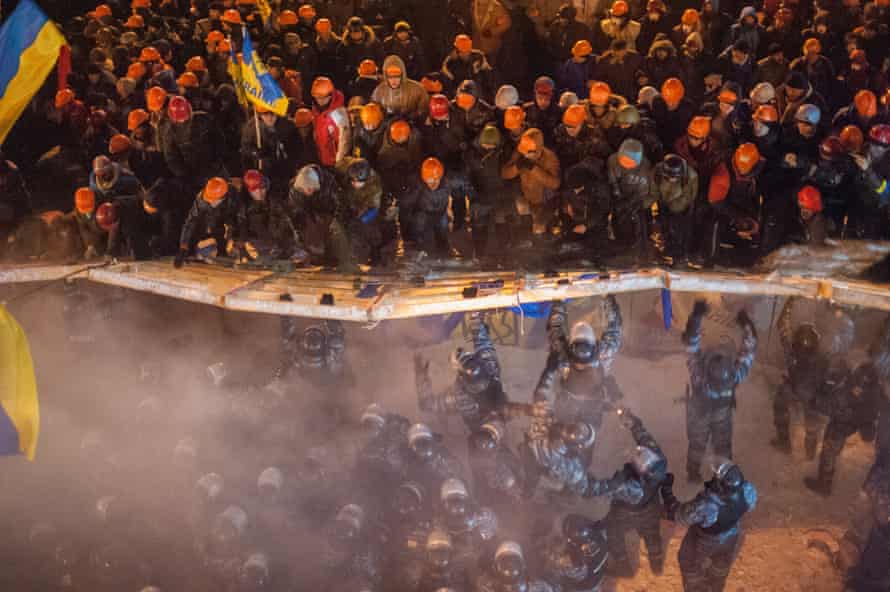 Ukrainian demonstrators clash with riot police officers at Maidan square in Kieve, in December 2013.