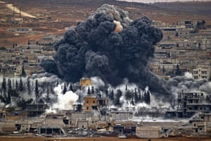 Smoke rises from the Syrian city of Kobani following an air strike by the US-led coalition. Kobani, also known as Ayn Arab, has been under assault by Islamic State extremists since September