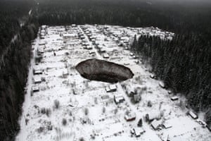 A photograph released by the Uralkali company press service shows an aerial view of a sinkhole near the Solikamsk-2 mine in the Perm region of Russia. According to local emergency services, the sinkhole poses no danger to the nearest town or to the mine