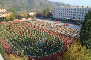 In the final photograph this week, students sit an exam on a sports field at Shaanxi Sanhe College, Baoji, China. The teachers there believe that making students sit exams outside will help prevent cheating